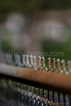 Rusty chain link fence top perspective