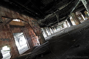 Abandoned parking perspective with damaged bricks walls