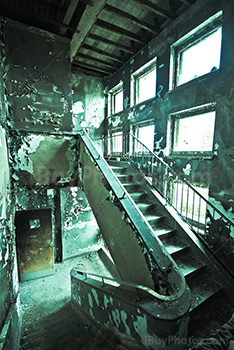 Damaged steps on old stairs in abandoned building